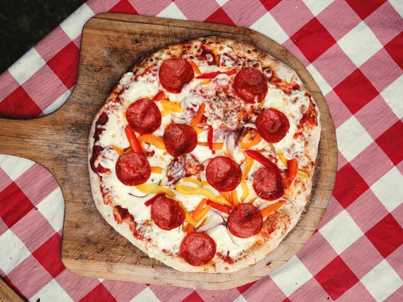 Spicy Pepperoni pizza with jalapeños and hot sauce